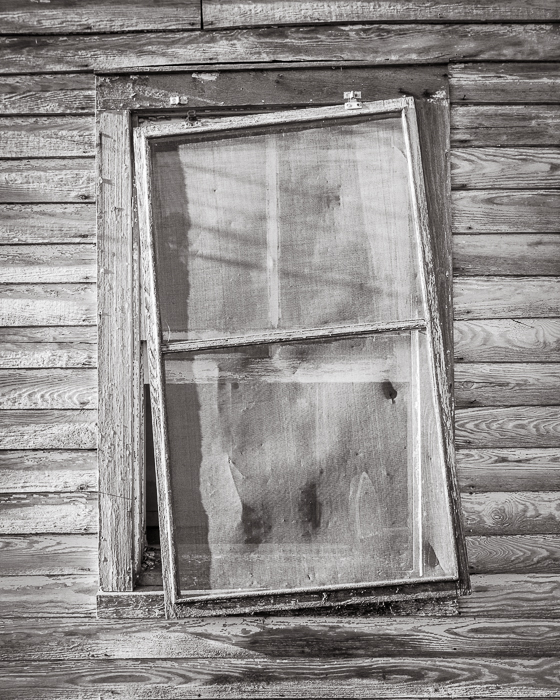 photograph by Bryan Hatchett, copyright, Bryan Hatchett, black & white photograph, distressed window in 2012 near Providence Forge, Virginia