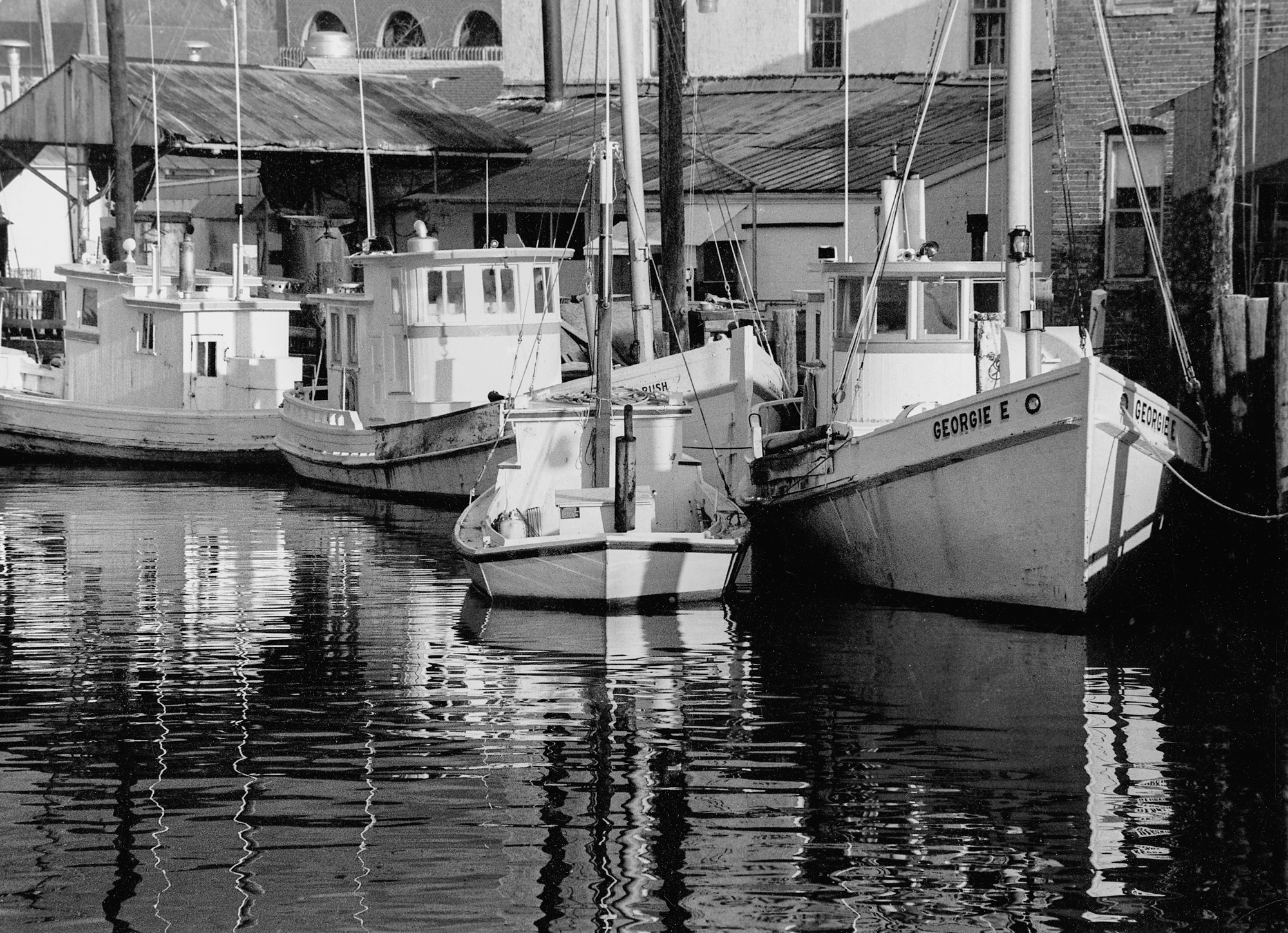 photograph by Bryan Hatchett, copyright, Bryan Hatchett, black & white photograph, Hampton Creek, in the early 1980s, Hampton, Virginia, Chesapeake Bay deck boats