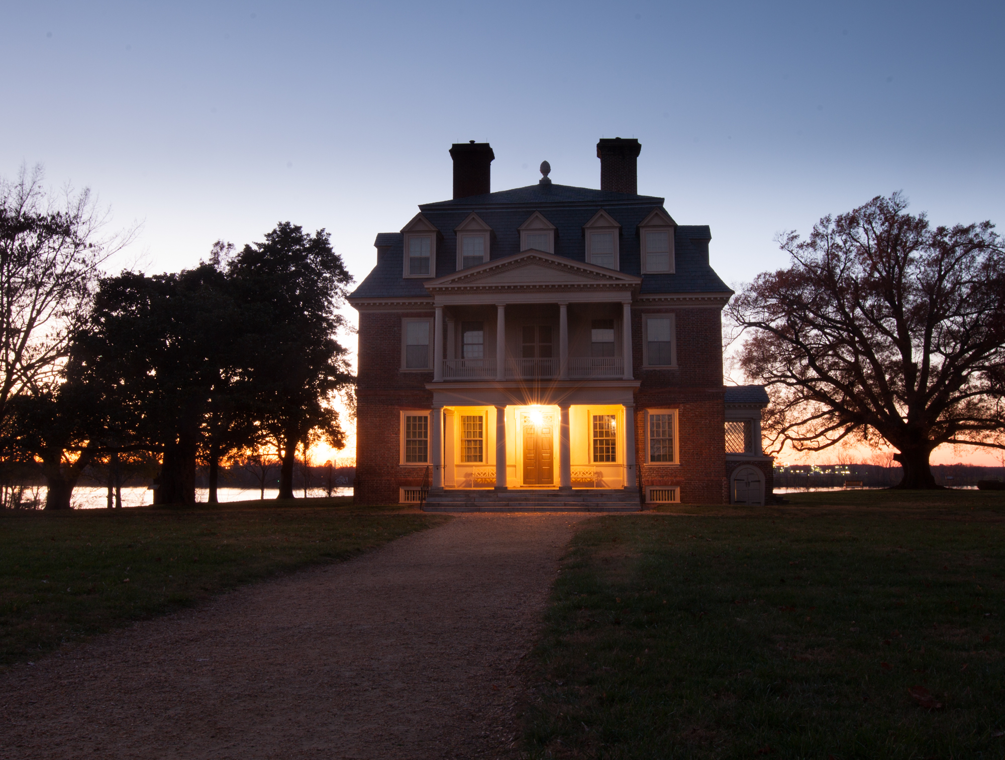 photograph by Bryan Hatchett, copyright, Bryan Hatchett, color photograph, the Great House at Shirley Plantation at twilight, Charles City County, Virginia